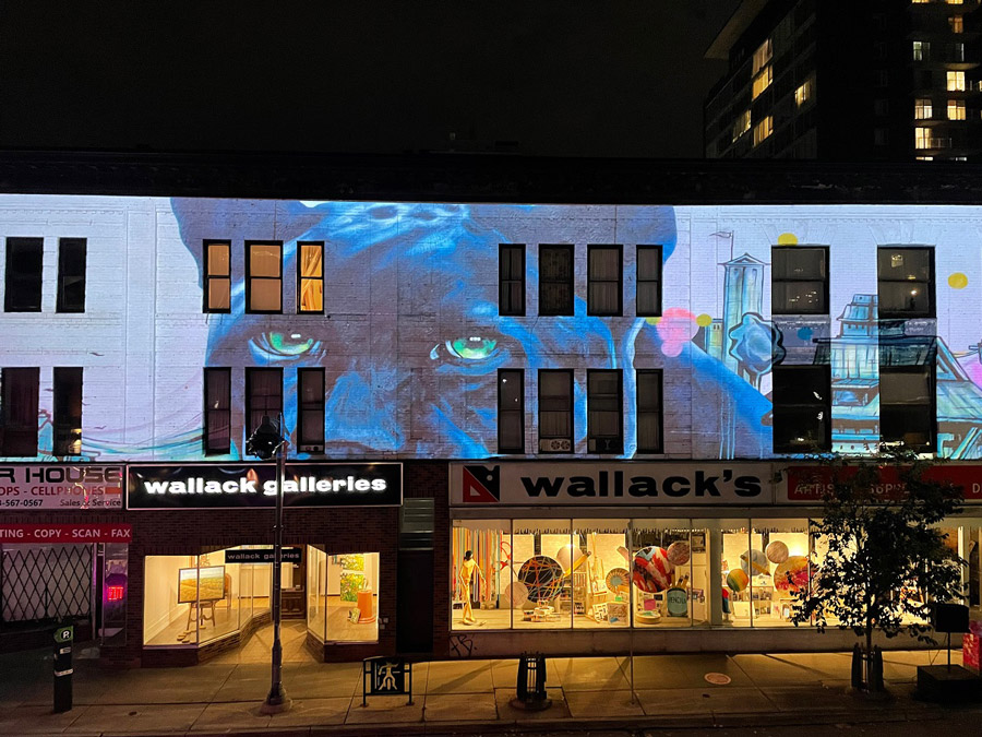 An artistic mural is projected onto the walls of downtown Bank Street as part of the Fire & Ice festival.