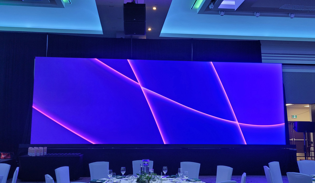 Blue video wall with decorative pink lines displayed