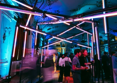 OSE Event Portfolio Photos - Canadian Institute of Actuaries LED Tube Lights Tunnel - tube lights are pink with the walls around the tunnel being lit with difused blue lighting